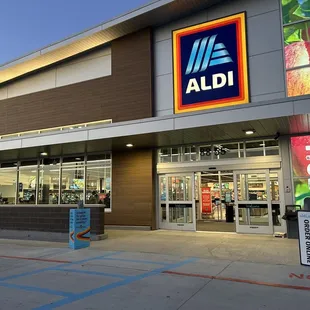 the front of a store with a sign in front of it