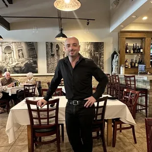 a man standing in a restaurant