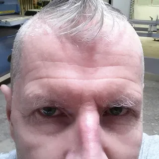 Iain L.