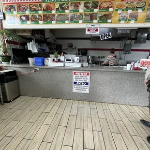 a man standing in front of a counter