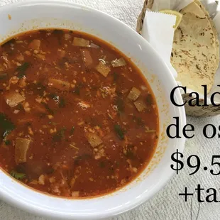 a bowl of chili and tortilla