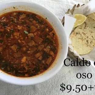 a bowl of chili and tortilla