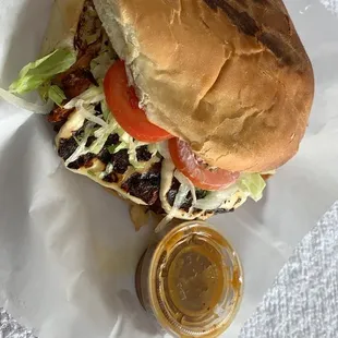 a sandwich with lettuce and tomato