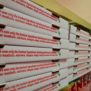 a stack of pizza boxes