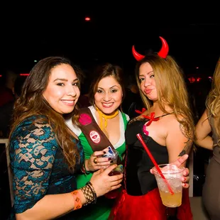 three girls dressed up for a party