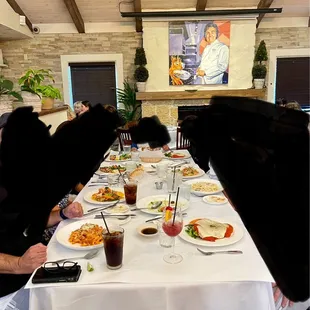 Array of entrees including chicken, various pasta dishes and seafood.