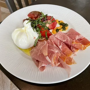 Burrata with prosciutto and heirloom tomatoes