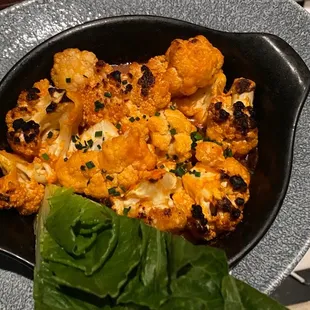 a bowl of cauliflower and sauce