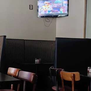 a flat screen tv in the dining room