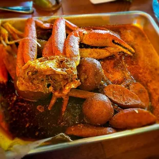 Snow crab boil (1lb) with potatoes and sausage with all 3 sauces.