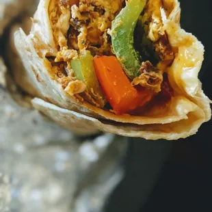I DETEST photos where ppl have take a bite. Sorry. Chorizo, egg, bell pepper, onion potato, cheese breakfast burrito perfection!