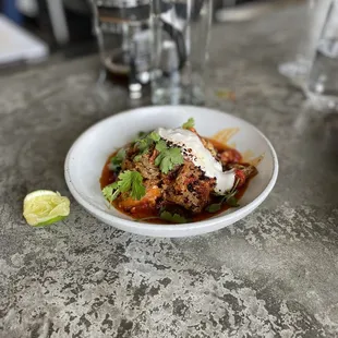 Menemeh - slow cooked, shredded leg of lamb in a (delicious!) shakshuka like sauce... flavor in this is incredible.