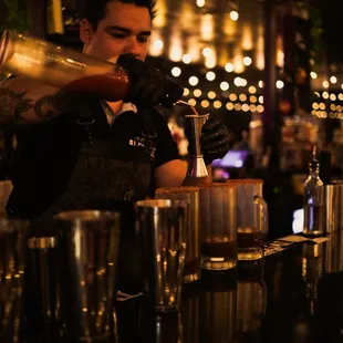 bartender pouring a drink