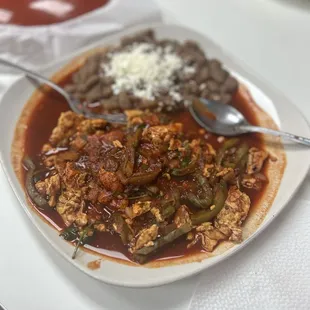 Scrambled eggs with cactus in red sauce