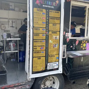 a food truck with menus