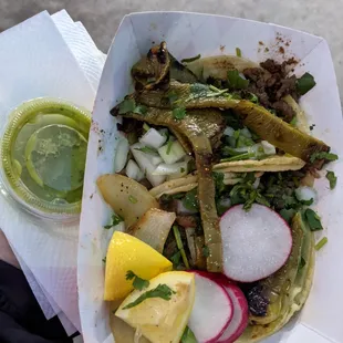 There are 2 tacos under that goodness.