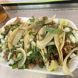 Bomb tacos de tripa and suadero.
