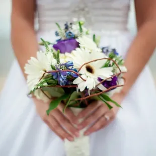 Spring Bridal Bouquet of gerbera daisies, lisianthus, delphinium, and curly willow captured by Like a Dream Photography.