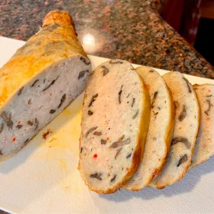 sliced sausage on a cutting board