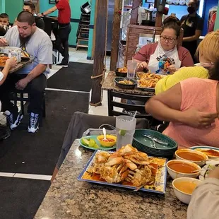 a group of people eating at a restaurant