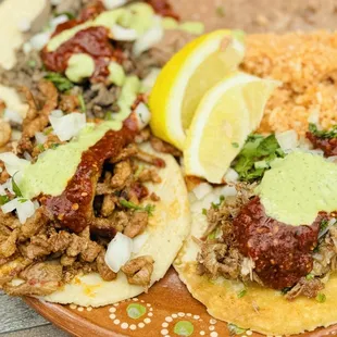 Carnitas, beef, and al pastor tacos.