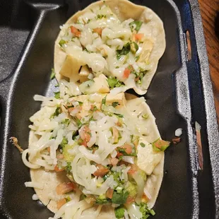 Two delicious potato tacos.