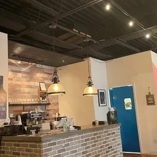 a bar with a television on the wall