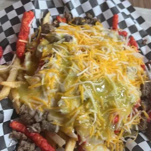 Hot Cheeto Fries with steak and green salsa