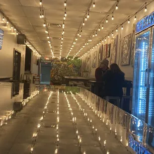 a man and a woman sitting at a bar