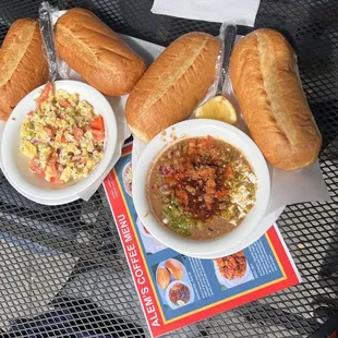 two bowls of soup and two rolls of bread