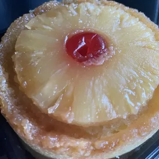 a pineapple pie with a cherry on top