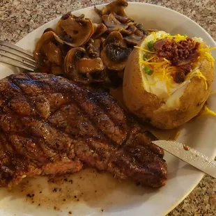 Ribeye steak, mushrooms, loaded baked potato, all good.