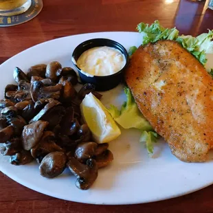 Tilapia and sautéed mushrooms.  Done really nice.