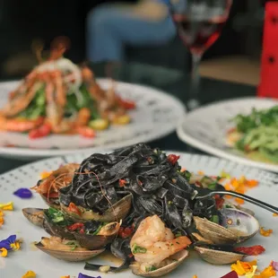 a plate of pasta with shrimp and shrimp
