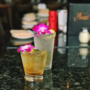 two cocktails on a table