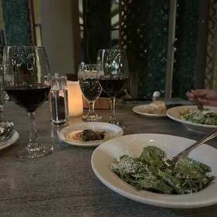 Caesar salad and house red blend