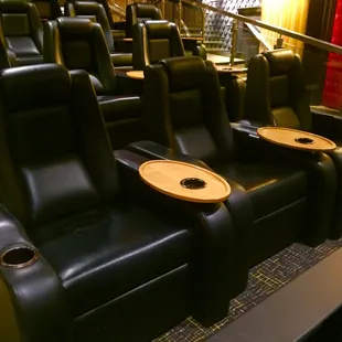 a row of black leather seats