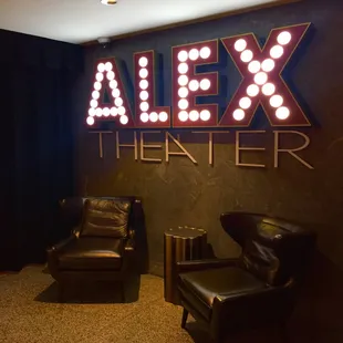 two chairs and a sign