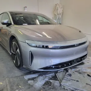 Almost invisible paint protection film installed on the front of this beautiful electric car called Lucid.
