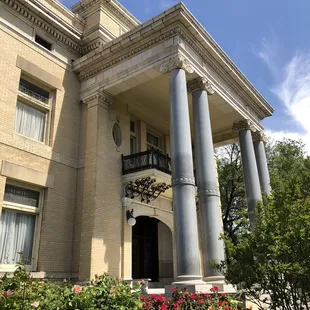 Stately granite columns on front porch of the Alexander Mansion, built in 1904.