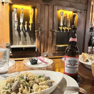 Stroganoff and Budweiser in front of the classic icebox taps