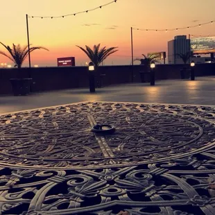 Cute table (chairs/ bench as well) during the sunset.