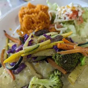 Enchilada with vegetables on top was decent