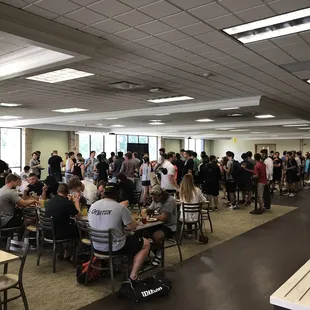 a large group of people eating