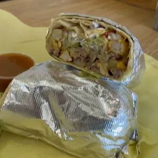 a burrito wrapped in aluminum foil