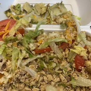 Salad with ground chicken, tomato, smothered in cheese. Was hard to find the iceberg. Don't worry, I couldn't and didn't actually eat this