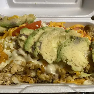 Salad with ground chicken, with sliced tomato, smothered in cheese, with avocado. I should've just ordered a burrito