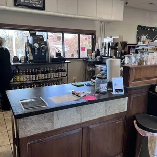 a coffee shop counter with a coffee maker