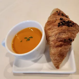 Complimentary tomato soup and croissant