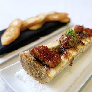 Roasted Bone Marrow w/ basil breadcrumbs, shiitake mushroom duxelle, unagi | $25